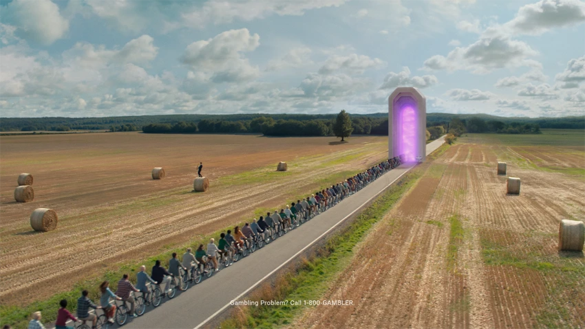 A crowd of people on a tandem enter a magical portal through a marble archway.