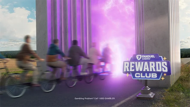 A crowd of people are driving the tandem through the magic portal inside of the marble archway.